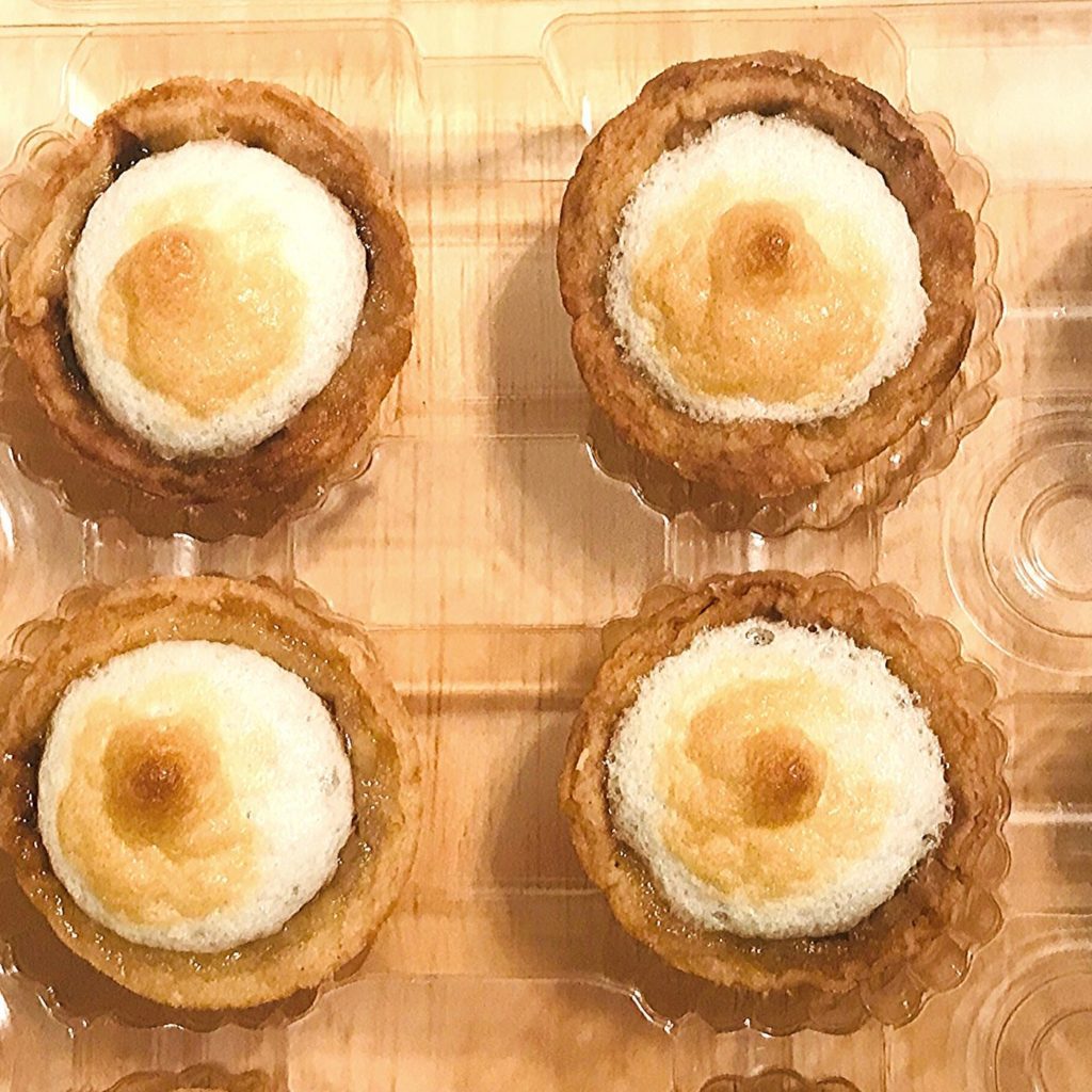 four petite banana cream pies
